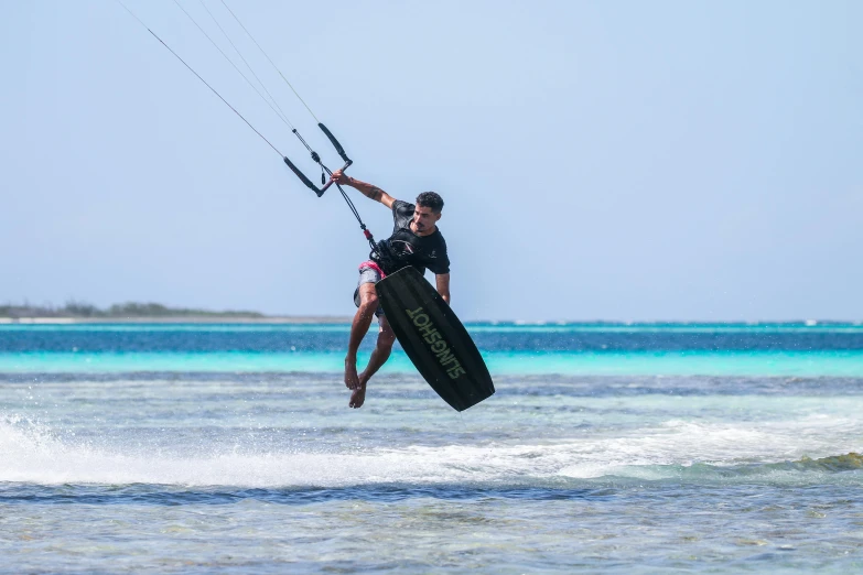 a man on water skis and a girl holding onto to their board