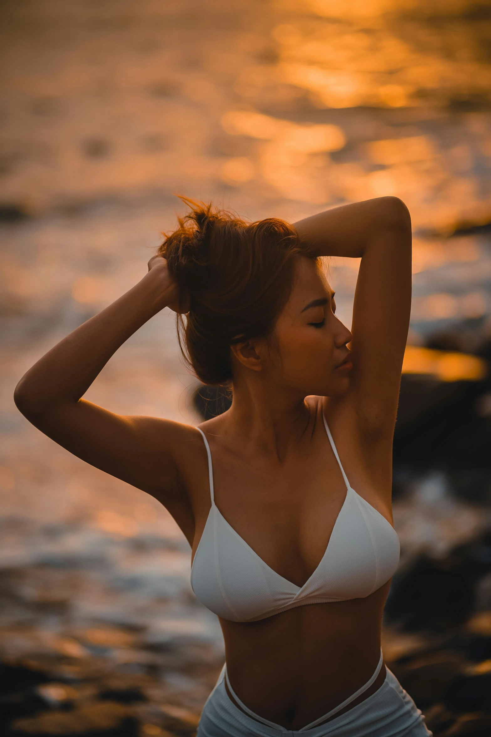 the woman is posing for a picture with her hair in a bun