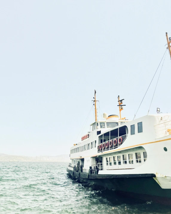 a ferry ship on the water in a body of water