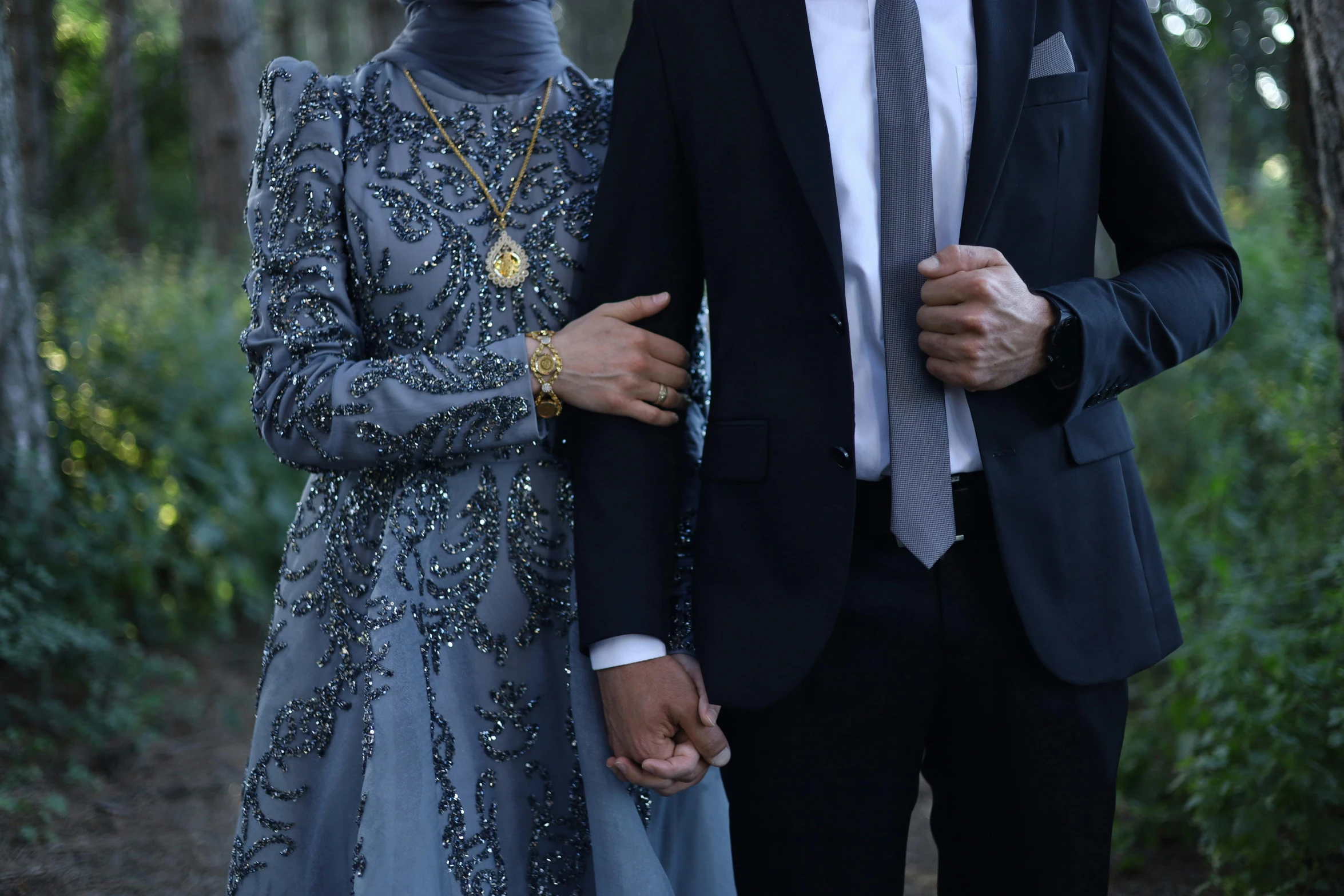 man and woman walking together outside during the day