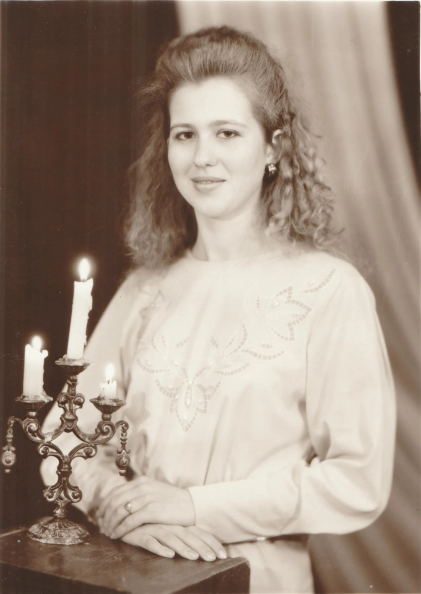 vintage black and white pograph of a woman with a candle