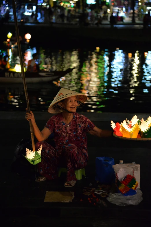 the woman sits in front of her lighted lights