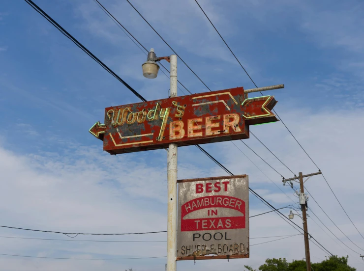 the neon sign is above the old neon sign