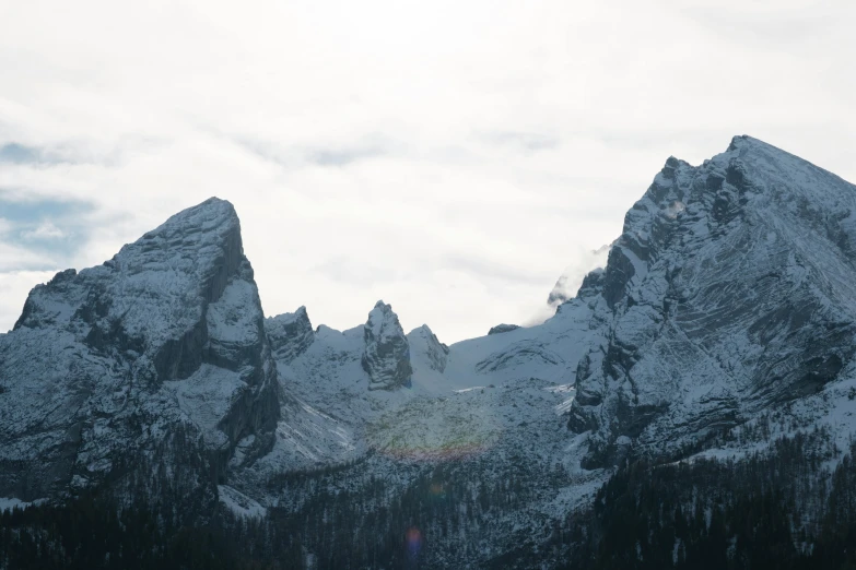 the view of three mountains at the bottom of the slope