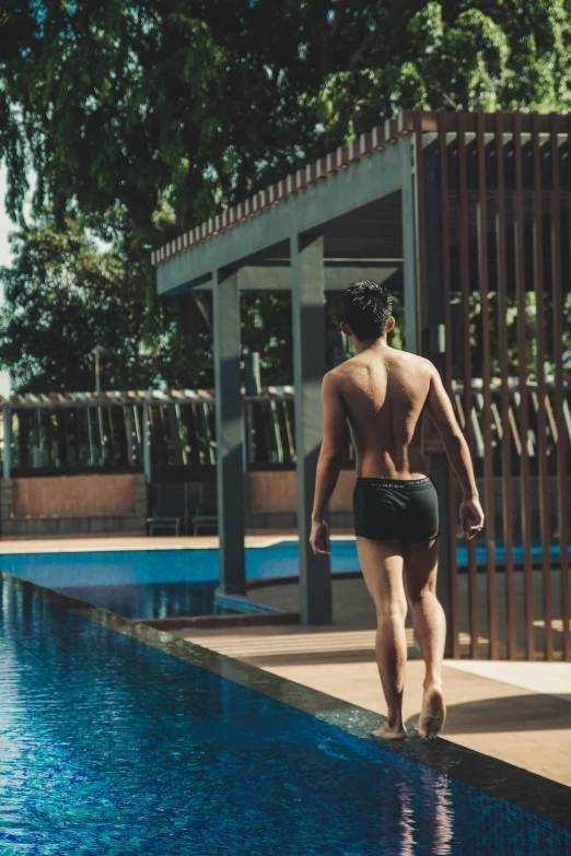 a man with  walking into the water