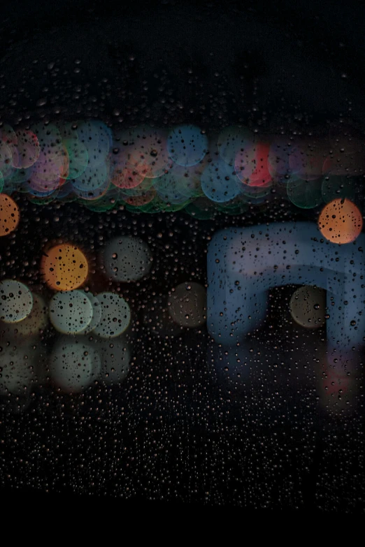 closeup of lights and bubbles on a dark surface