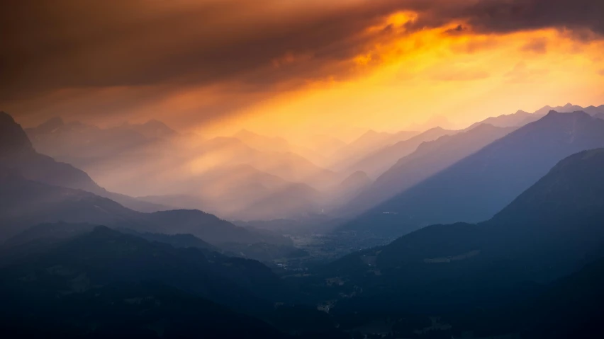 the view from the top of the mountain with clouds