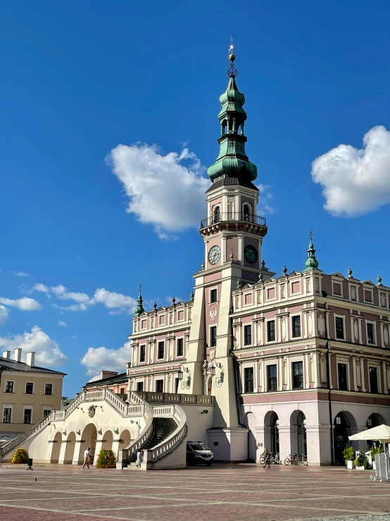 an old building with a clock tower towering over it