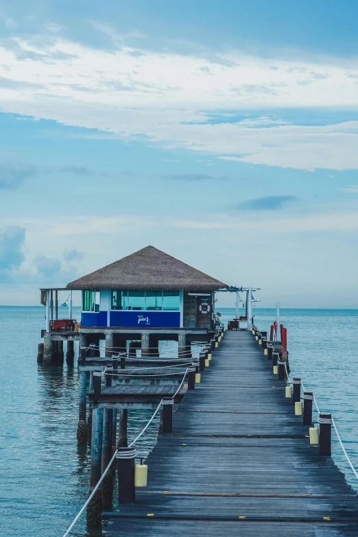 a pier that has some water next to it