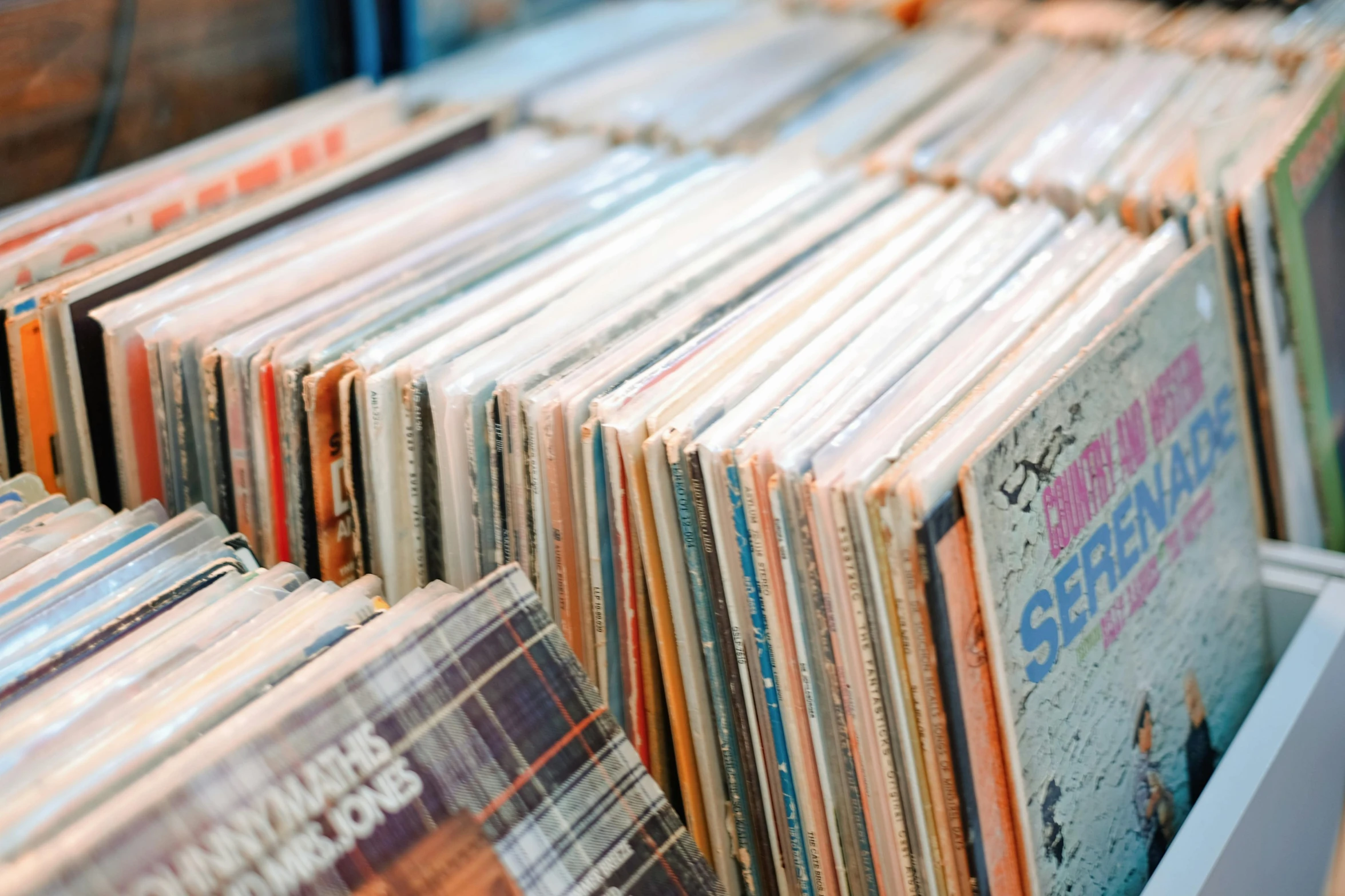 a rack with various types and shapes of records