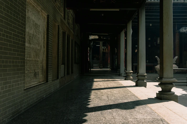 the pillars and wall of the building are covered in writing