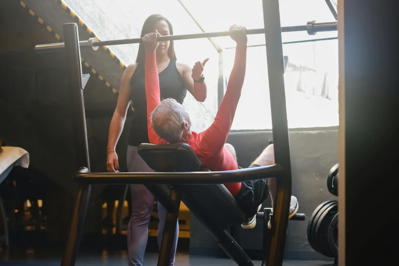 two women are at the gym on the bench