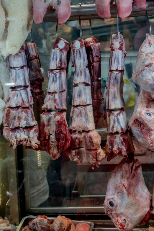 meat hanging on a rope in a restaurant