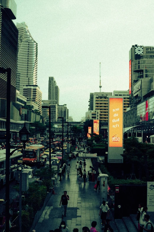 a busy street is full of people walking