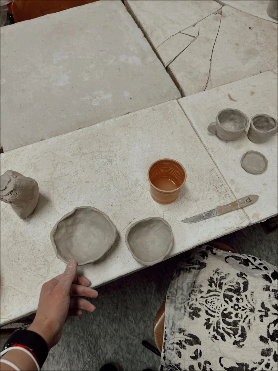 a person that is working on clay