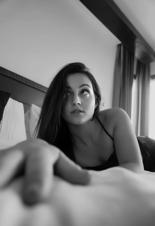 an image of a beautiful woman on the bed