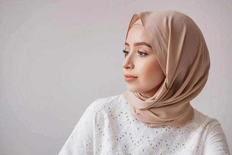 a woman wearing a headscarf with a lace