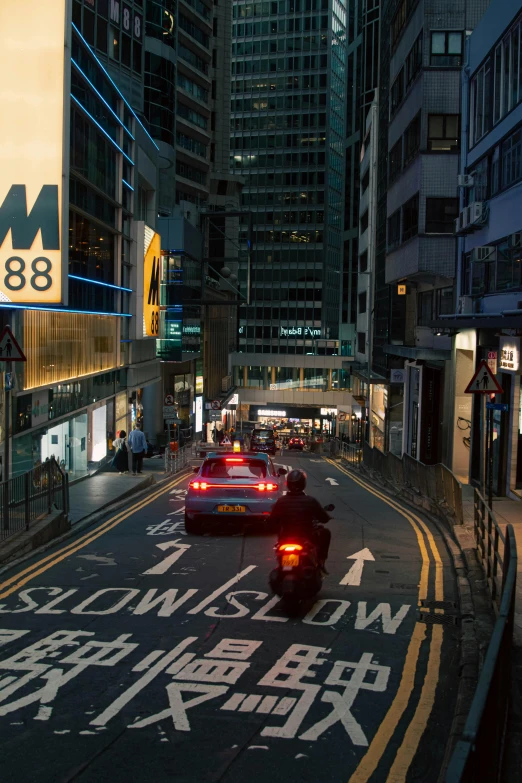 a busy street with many buildings at night