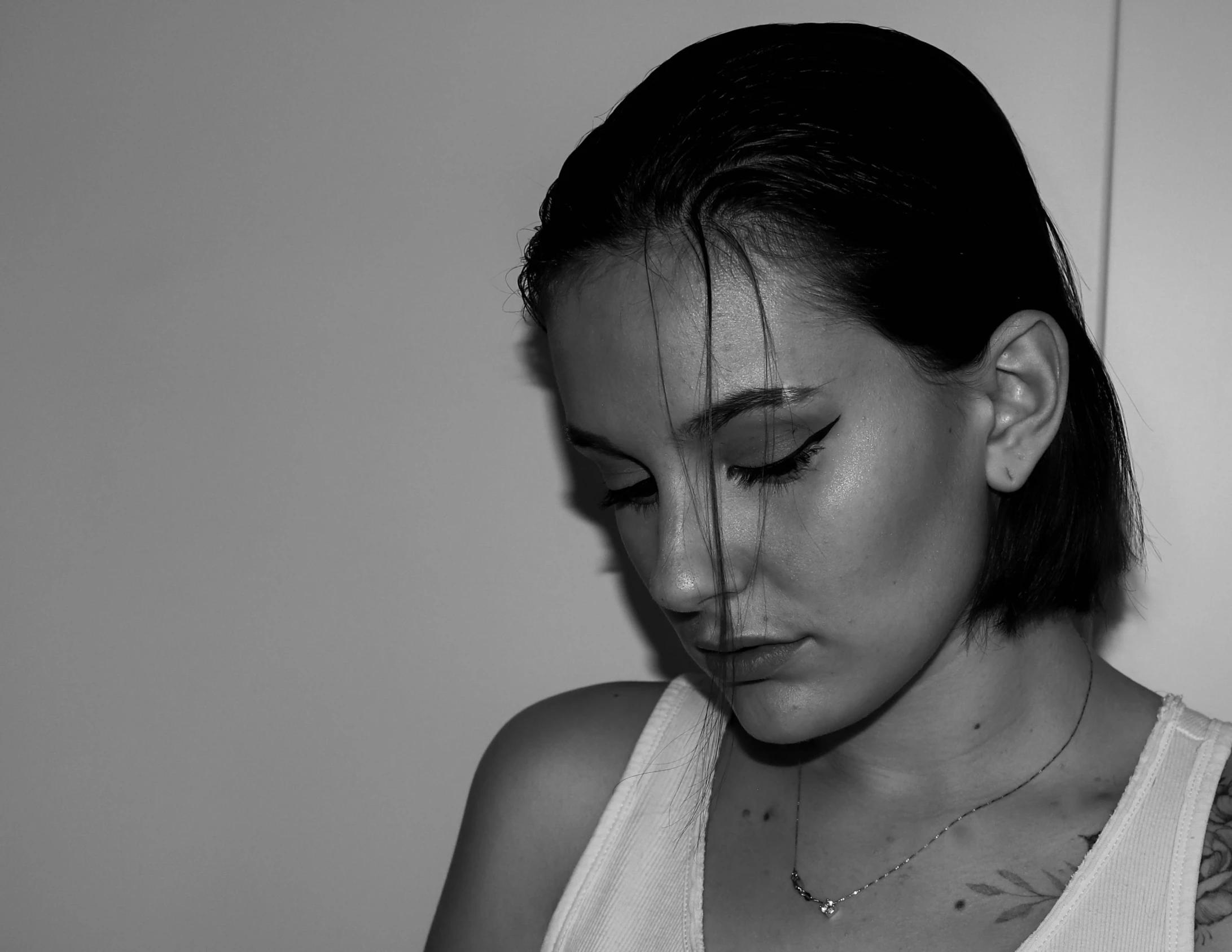 black and white image of woman wearing a neck tie