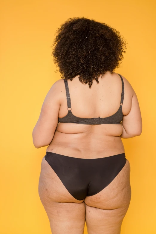 a woman is shown in her bikini top