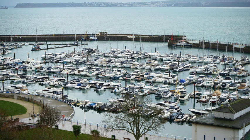 an aerial view of a harbor full of boats