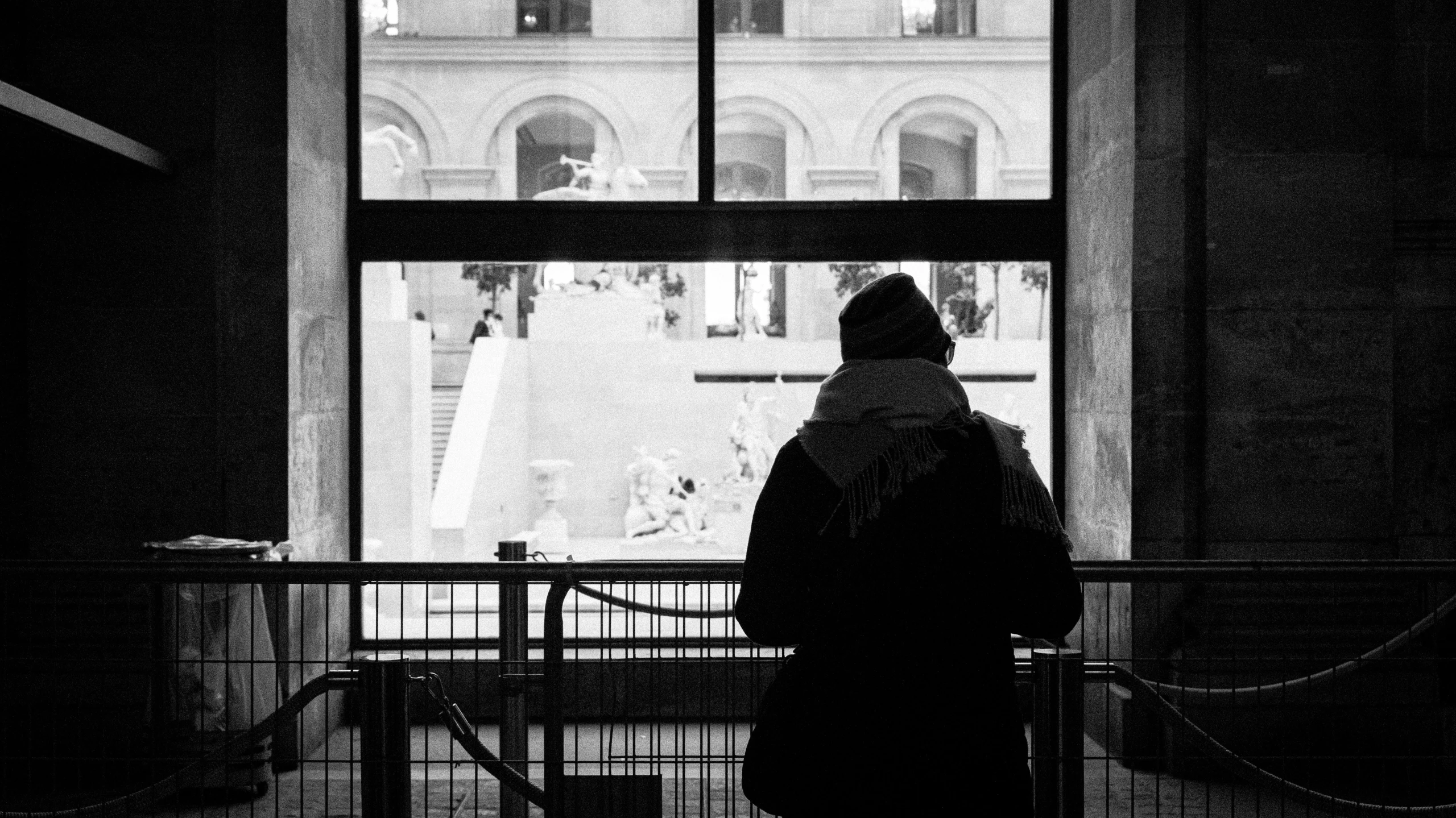 a man that is standing in front of a window