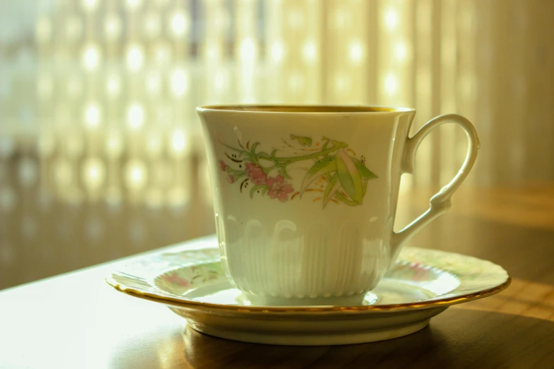 a cup sitting on top of a saucer