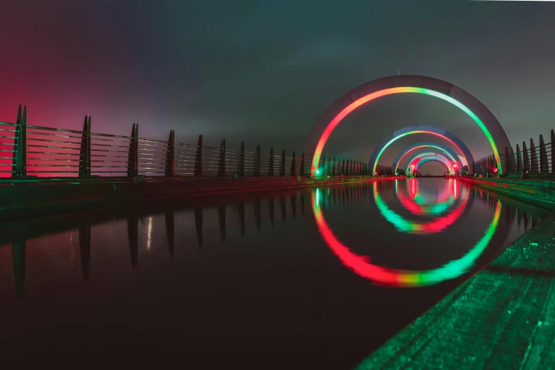 a rainbow light display on top of water