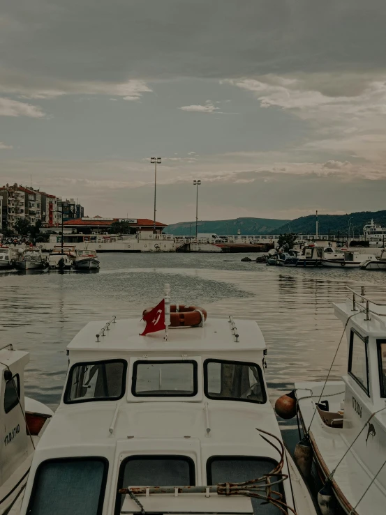 three boats docked in the water next to each other