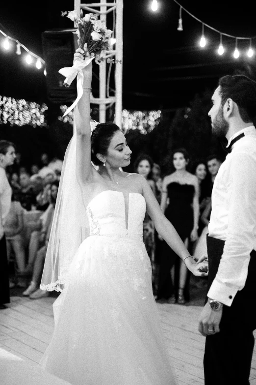 black and white pograph of a bride and groom dance