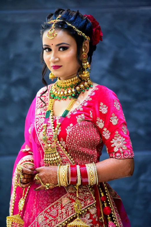 woman in bright indian garb and jewelry