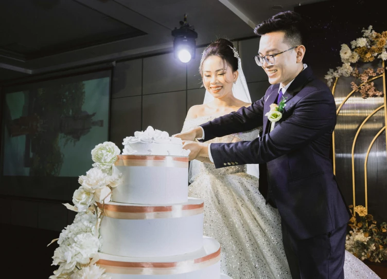 a man and woman  a wedding cake