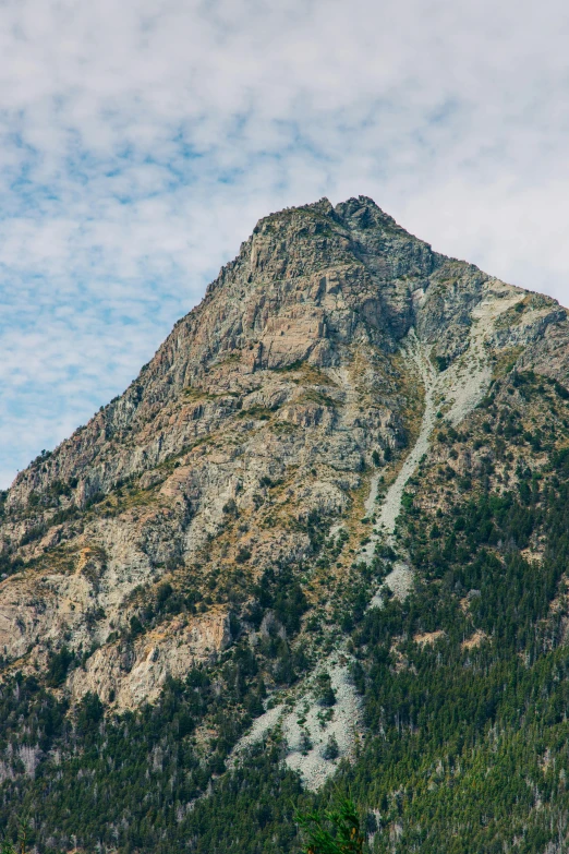 the top of a very steep mountain with no snow