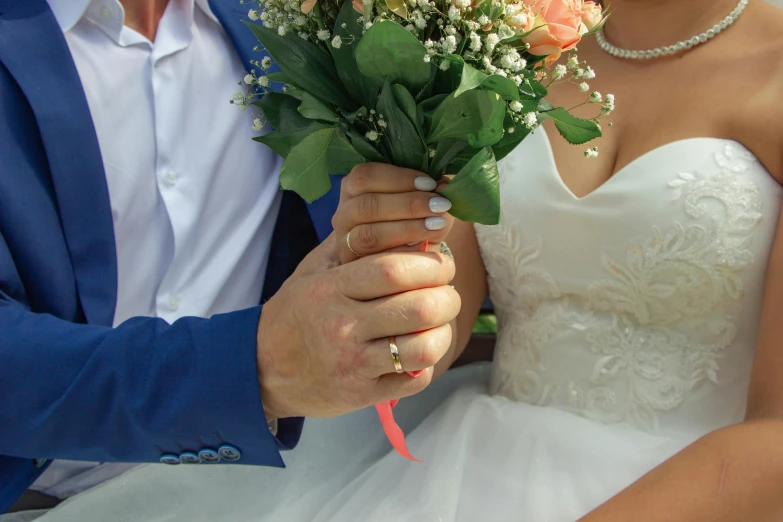 a close up of a person holding flowers