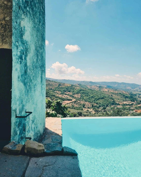 the view out over a small pool overlooking a beautiful countryside