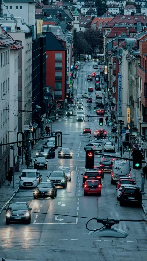 many cars that are sitting in the road