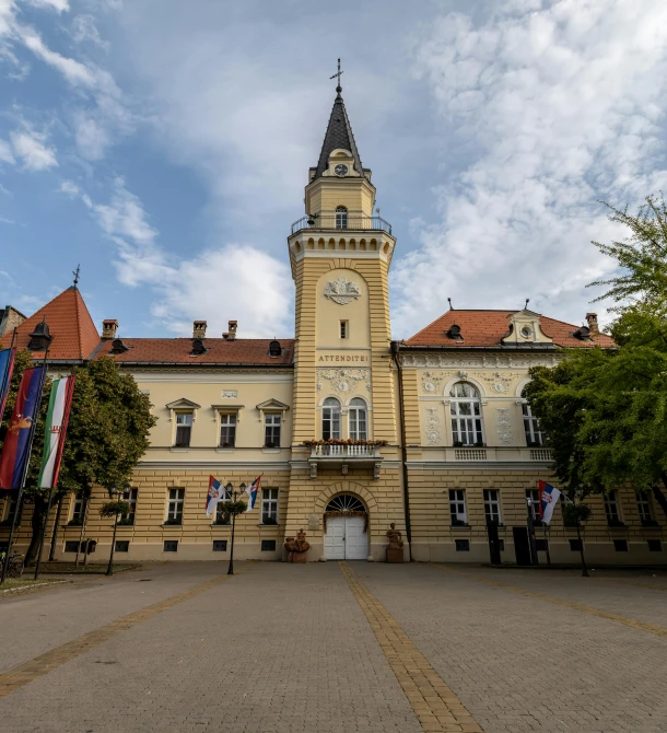 large building with clock tower and multiple windows