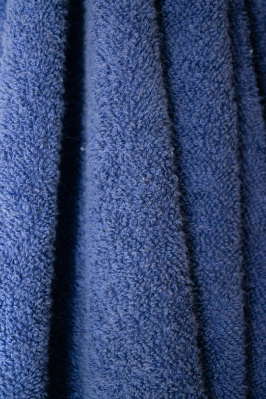 the light is reflected off of the dark blue towel