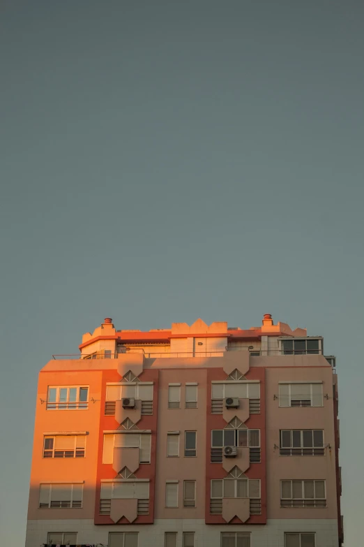 a bird flying through the air near a building