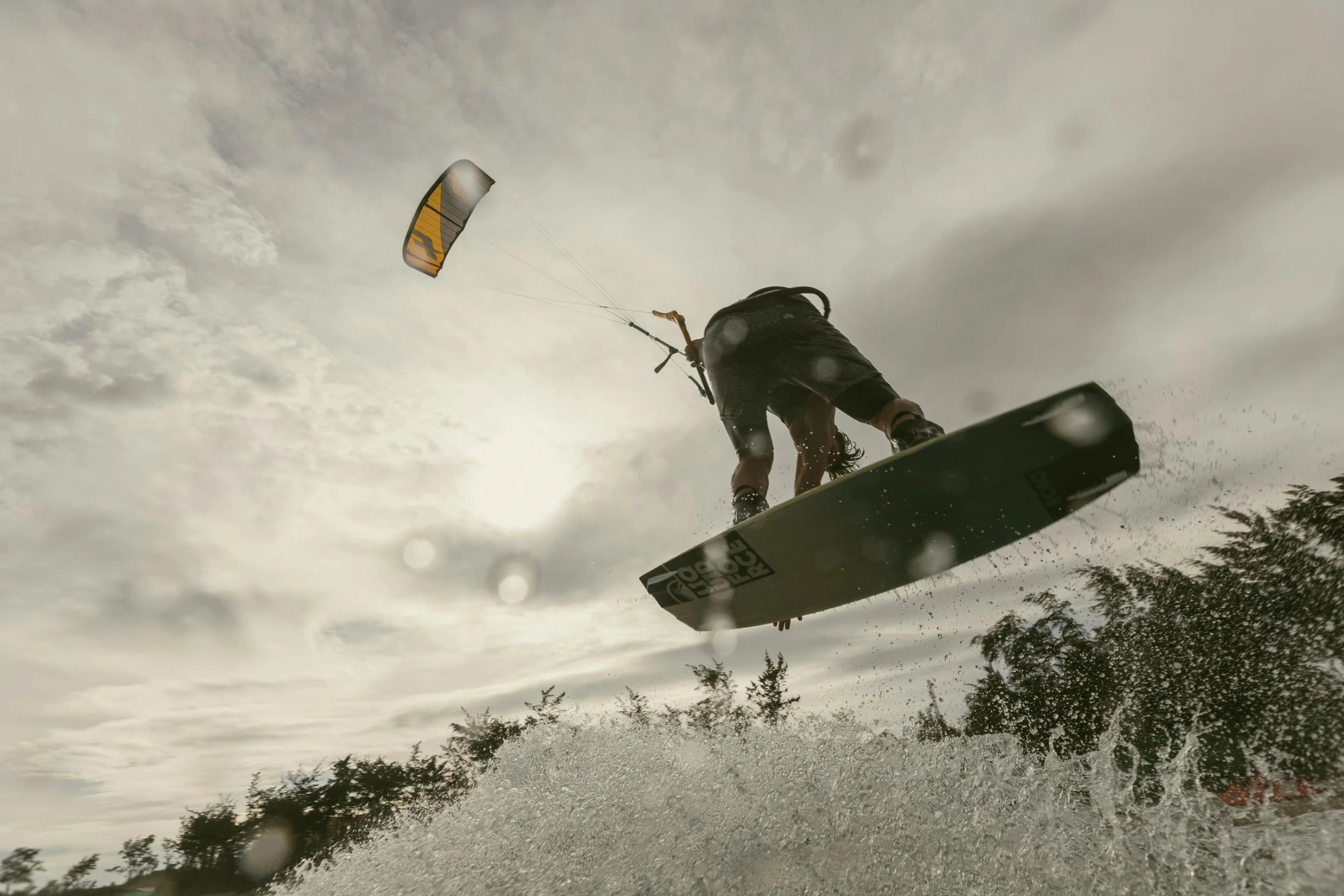 a person that is flying through the air with a kite