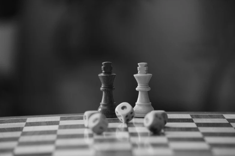 chess pieces are displayed on a checkerboard table