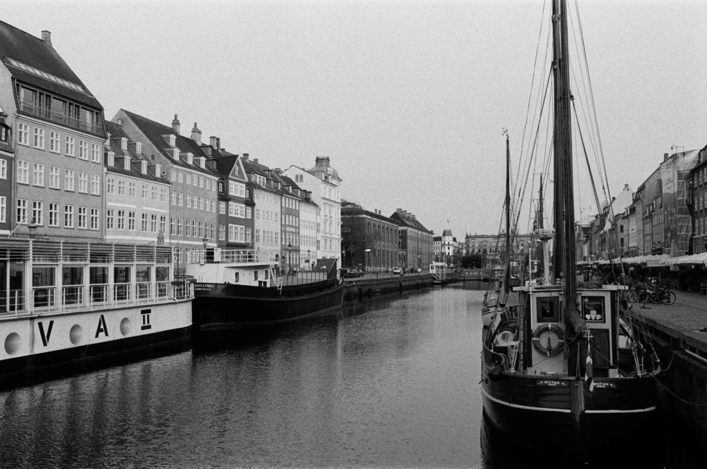 boats are parked next to the water