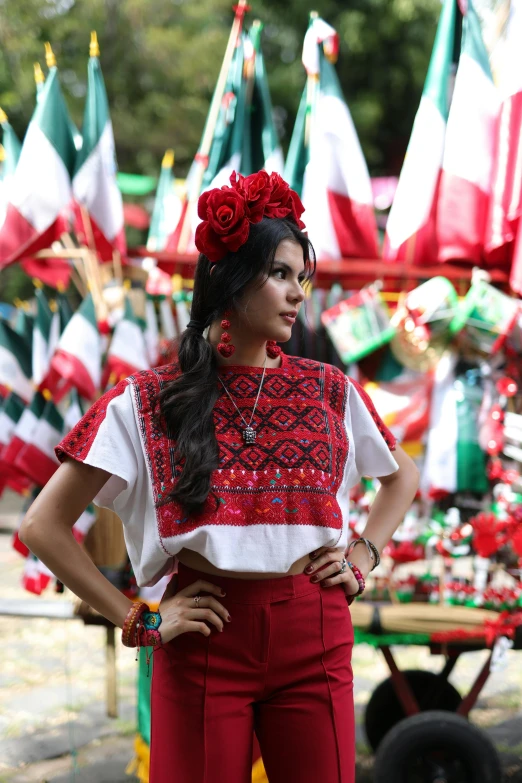 a woman is wearing red and white clothing