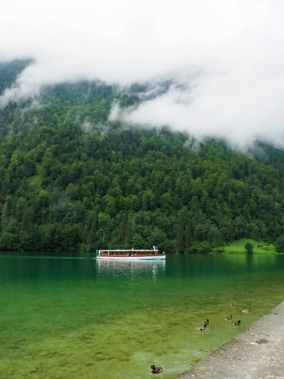 a boat out on the water near a shore