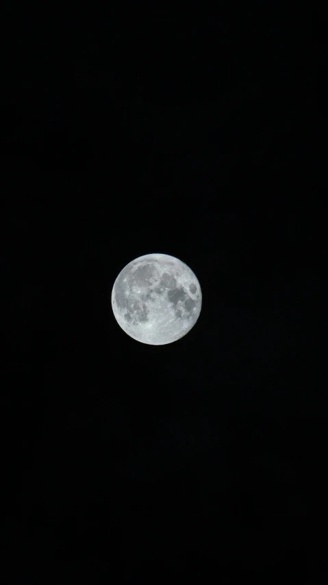 a bright full moon in the night sky