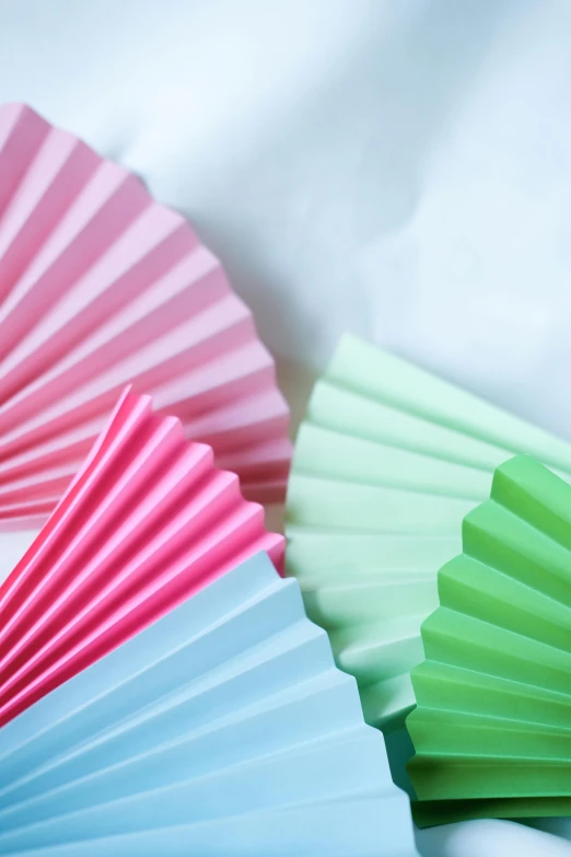 colorful paper fans sit next to each other