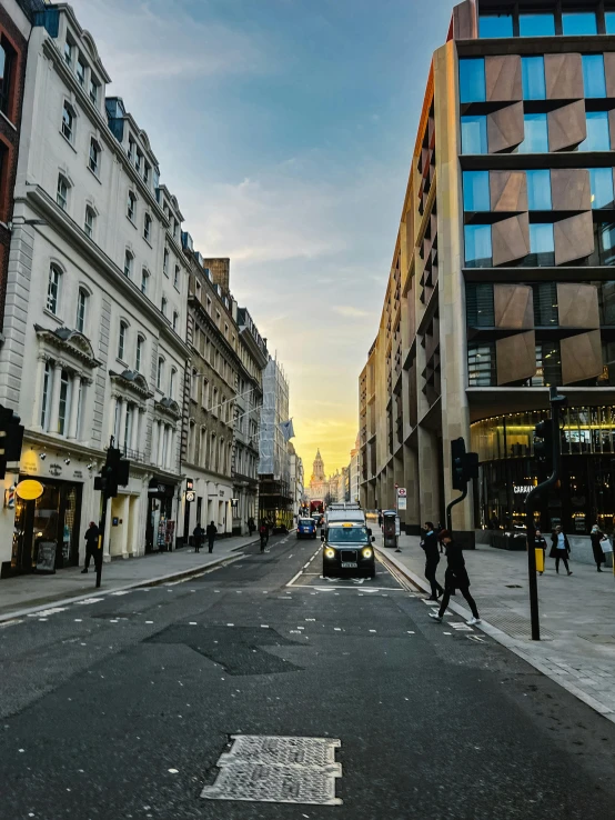 a city street with people walking around on a sunny day