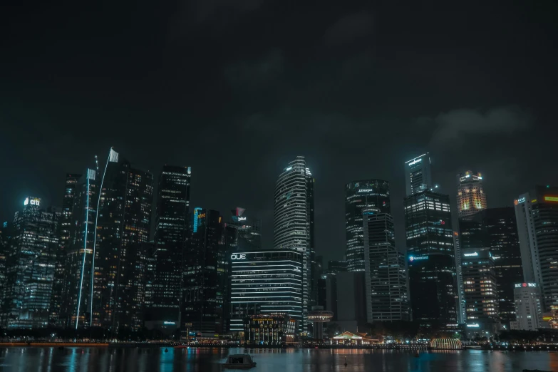 a city at night as seen from the water