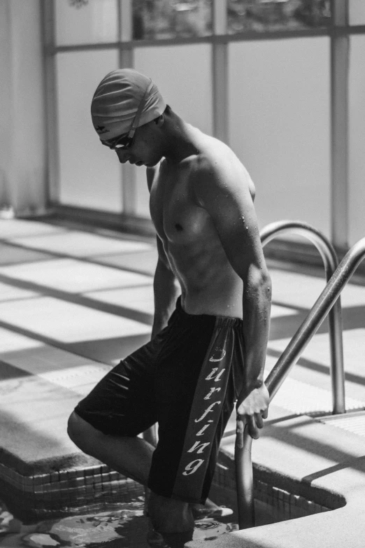 a man standing near an open pool with 