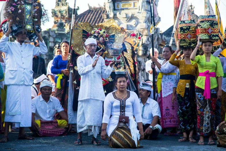 a group of people sit in front of floats